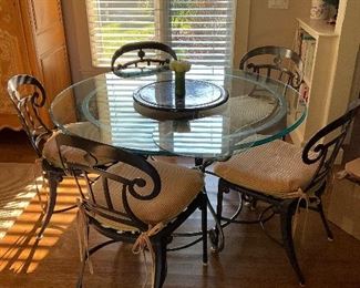 Glass top table with 6 chairs, one not pictured 