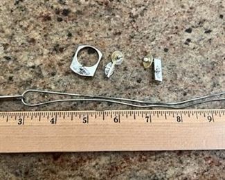 #J20  Silver necklace with pendant with clear stone, matching pierced earrings and ring.  The ring measures just over 8 on a ring sizer.   Price $40.00 for the set