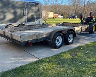 2003 - 16’x7’ flat bed trailer. 7000# gvw.  Ramps. Nearly new tires.