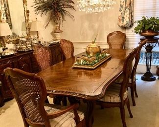 Elegant dining table with 6 wood/cane back chairs