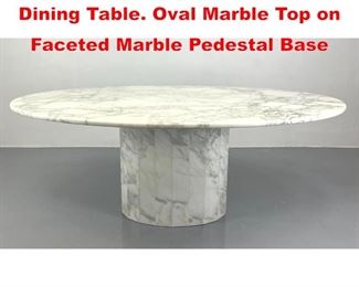 Lot 24 Italian style Marble Pedestal Dining Table. Oval Marble Top on Faceted Marble Pedestal Base