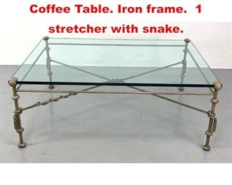 Lot 118 Large Decorator Glass Top Coffee Table. Iron frame. 1 stretcher with snake. 