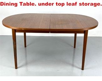 Lot 170 Danish Modern Oval Teak Dining Table. under top leaf storage. 