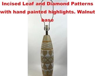 Lot 210 Italian pottery lamp. Incised Leaf and Diamond Patterns with hand painted highlights. Walnut base