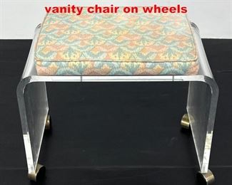Lot 302 Mid Century Modern Lucite vanity chair on wheels
