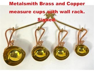 Lot 348 JOE SPOON 2000 Metalsmith Brass and Copper measure cups with wall rack. Signed.