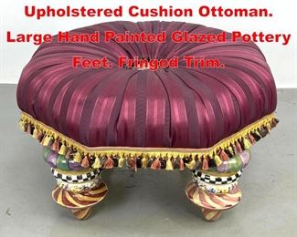 Lot 390 MacKENZIE CHILDS Upholstered Cushion Ottoman. Large Hand Painted Glazed Pottery Feet. Fringed Trim.