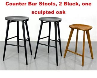 Lot 410 Three Sculptural Wood Counter Bar Stools, 2 Black, one sculpted oak