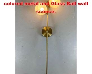 Lot 467 Contemporary Brass colored metal and Glass Ball wall sconce.