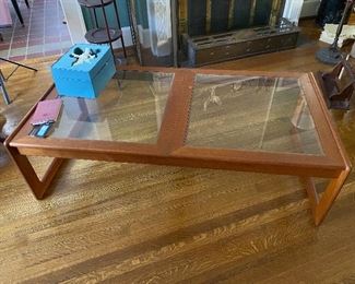 Groovy teak and glass coffee table.