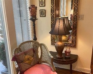 Left side of entry with French pier mirror , carved Victorian plant stand and the other French cane back armchair 
