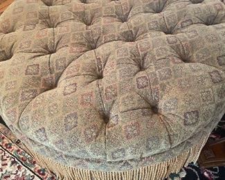 Large upholstered ottoman with fringe 