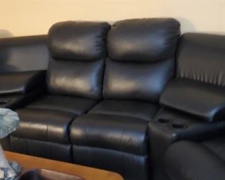 Nice leather curved sectional...there is a triangle shaped foot stool/storage that goes with this