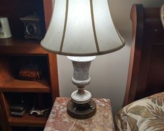
Pretty lamp on marble top side table 