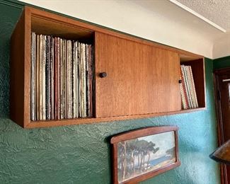MCM teak wall unit filled with records.