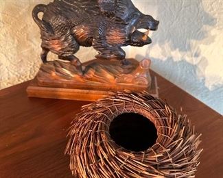Carved wood bore and Native American pine needle basket,