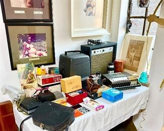 Vintage cameras, Sears guitar amp and various electronics.