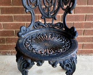 Antique cast iron porch chair
