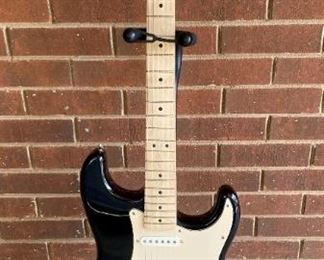 Fender Starcaster and Peavey guitar stand