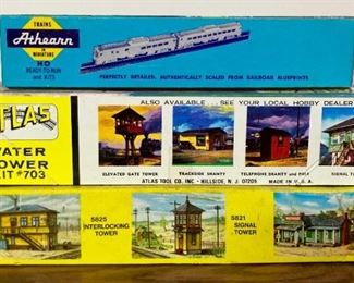Assorted HO scale model railroad cars and buildings for layouts