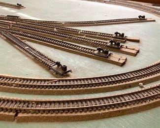 Assorted HO scale model train layout track and accessories