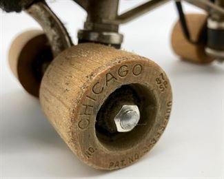 Vintage adult black leather wooden wheel roller skates