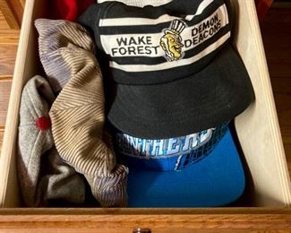 Assortment of hats including straw hats, snap backs, fitted, engineer caps, NCAA and Professional sports, and more