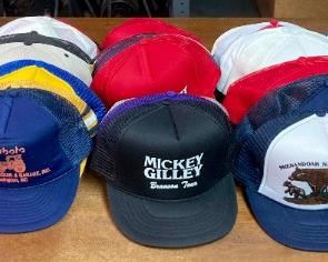 Assortment of hats including straw hats, snap backs, fitted, engineer caps, NCAA and Professional sports, and more