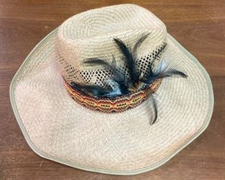 Assortment of hats including straw hats, snap backs, fitted, engineer caps, NCAA and Professional sports, and more