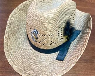 Assortment of hats including straw hats, snap backs, fitted, engineer caps, NCAA and Professional sports, and more