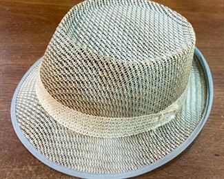 Assortment of hats including straw hats, snap backs, fitted, engineer caps, NCAA and Professional sports, and more