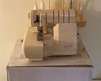Baby Lock Evolve Serger Model BLE8 and accessories