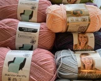 Yarn skeins including yarn by: Red Heart, Lion Brand, Caron, Impeccable by Loops and Threads, Simply Soft by Caron, Bernat, Studio Classic by Nicole, Lily Sugar 'N Cream