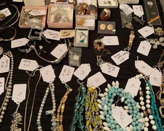 Assorted costume jewelry including some 14K and 10K gold pieces.