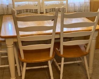 Table with 4 chairs & 1 stool.  Also has an additional leaf.