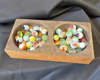 Old marbles in change tray