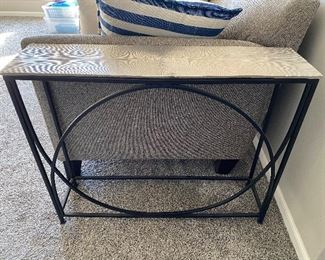 Fun accent table with metal base and top.