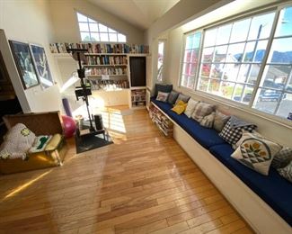 Vintage brass chest, posters, pillows.