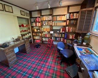 ARt works, books, desk and chair.