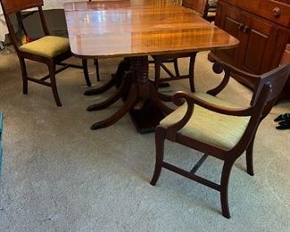 Duncan Phyfe style dining table and 8 chairs (not all chairs in photo) Includes 4 leaves