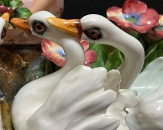 Vintage Mollica Planter - the details on this are simply lovely! Features a beautiful young girl perched among flowers with swans. Exquisite fine details in the modeling of the figurines and gives them a graceful quality as do the delicately hand painted features of the faces and the floral print of the girl's dress.
Measures 21" x 8" x 12". Signed on the back. A small very slight incidental hairline crack on the back which cannot be seen from the front of the planter.