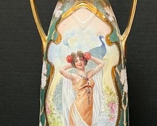 Beautiful Vintage German Portrait Double Handled Vase. Measures about 13" high and features a beautiful woman painted with exceptional details. Some light paint wear to be expected with age, mainly on the gold trim. Small chip on the bottom