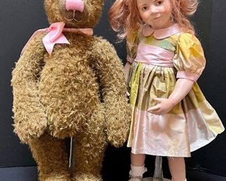 Loreli Wax over Porcelain Doll by Hildegard Günzel and Leo the Bear
Delightfully mischievous little girl with her partner in playfulness, handmade Günzel Bear, included as set. Loreli and Leo is an art doll by doll artist Hildegard Günzel. Loreli is made of wax over porcelain. Size of doll is 31 inches.
Loreli is an art doll by doll artist Hildegard Gunzel. Loreli is a wax over porcelain doll measuring 31 inches. Her partner, Leo is a handmade bear by Hildegard.
Loreli and Leo is a limited edition of 20. Handwritten on the back of Loreli is written, "artist proof"