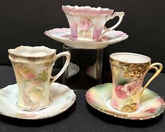 Three RS Prussia Teacups and Saucer Sets in a variety of patterns and sizes. All lovely painted with beautiful designs.