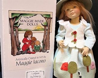 Mary Iacono Doll Mary artistically created in molded felt. This lovely doll is wearing an all wool felt, embroidered and appliquéd dress with her a little lamb country scene. Over the skirt, she wears a petal white wool felt vest. She is completed with human hair, felt shoes and fully ball-jointed with possible wired hands. Number 68/70 (2001). Measures 13"