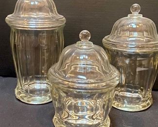Set of Three Antique General Mercantile Store Candy Jars measuring 9", 11" and 12" with the 11" jar having an interior chip.