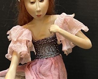 Tine Kamerbeek Doll Viola. Stone clay sculptured and seated on a one of a kind metal base. Measures about 15"