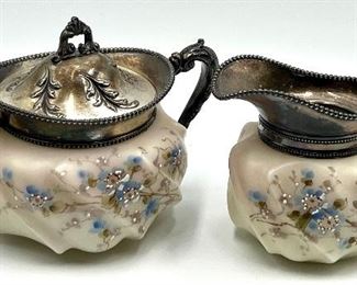 Antique Wavecrest Cream and Sugar Set. Beautiful floral design accented with silver plate. Measuring about 3” to 4”