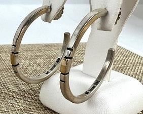 Sterling and 14k Hoop Earrings
Measuring about 1.4”