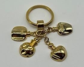 Vintage Christian Dior Perfume Bottle Keychain in good vintage condition with light wear.
Measures 3"